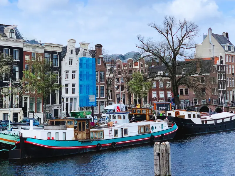 Sailing along the Amstel River in Amsterdam you pass the house boats and typical Dutch canal houses.